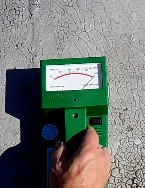 Moisture meter reading taken on a commercial roof