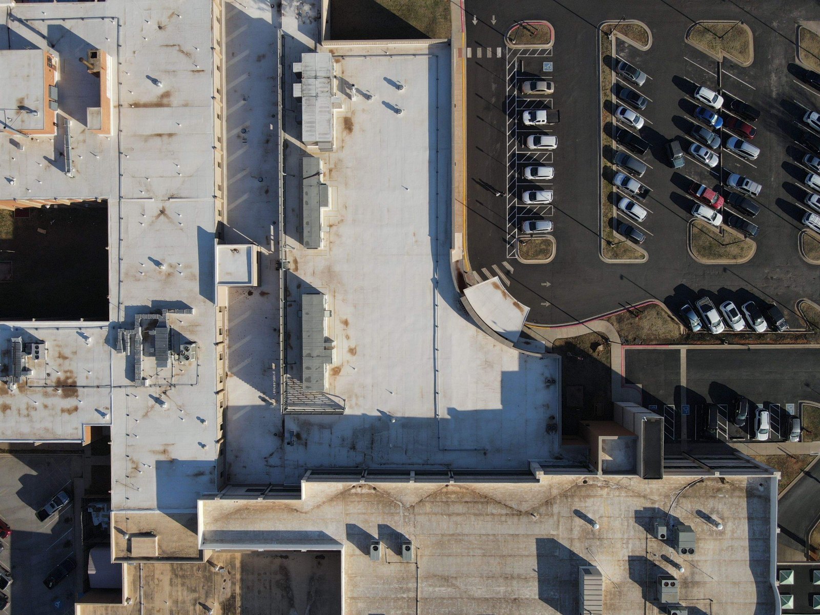 Overhead drone view of a large commercial roof