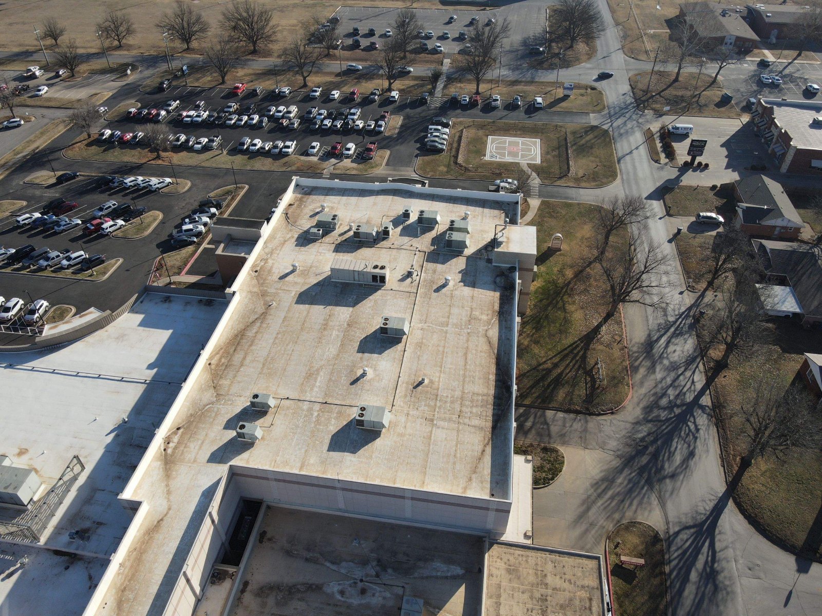 Drone view of a commercial roof with rooftop equipment