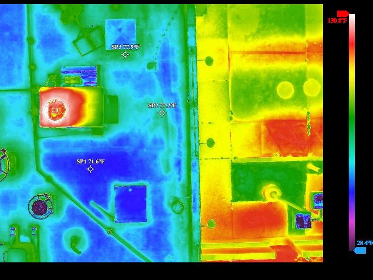 Thermal scan of a commercial roof with possible moisture areas called out